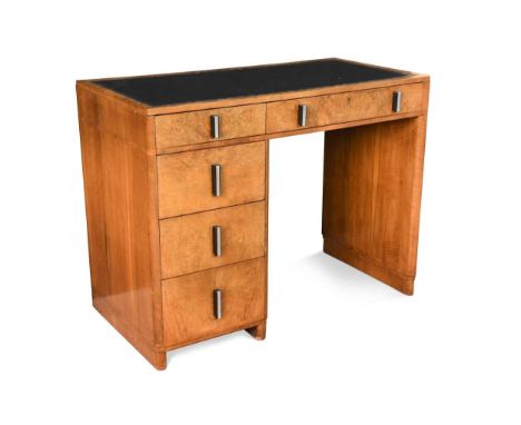 An Art Deco leather inset walnut desk, with two frieze drawers and three further short drawers to left side76 x 99 x 52cmCond
