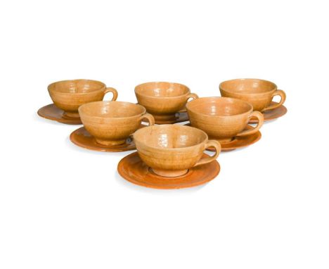 § Attributed to John Piper (1903-1992), six cups and eight saucers,with mustard glaze, the saucers with painted JP monogramth