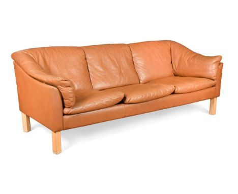 A Danish brown leather three-seater sofa, with loose cushions, raised on square section beech legs70 x 190 x 71cm