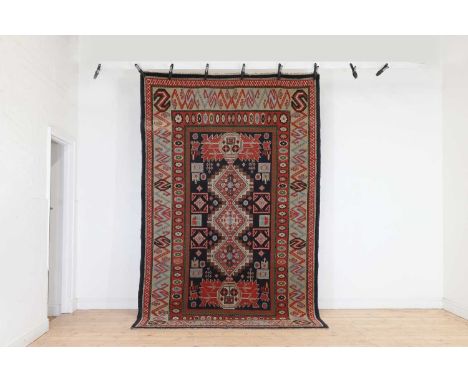 An Arts and Crafts wool carpet,c.1920, Irish, Donegal,310 x 195cm Condition ReportOne area with an apparent old repair. Gener