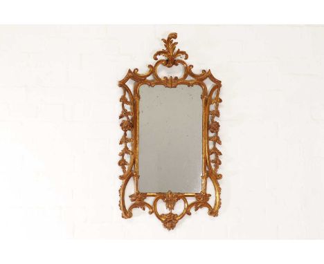 A small George II giltwood pier mirror,c.1755, the frame with scrolling rococo decoration, the edges decorated with trailing 