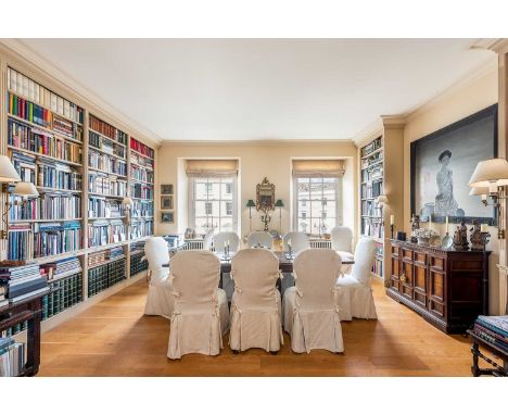 A set of ten George II-style mahogany dining chairs,20th century, each with an arched upholstered back, raised on acanthus-ca
