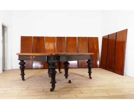 A large Victorian oak extending dining table by Eadon &amp; Son, Sheffield,c.1860, the rectangular top with a wind-out mechan