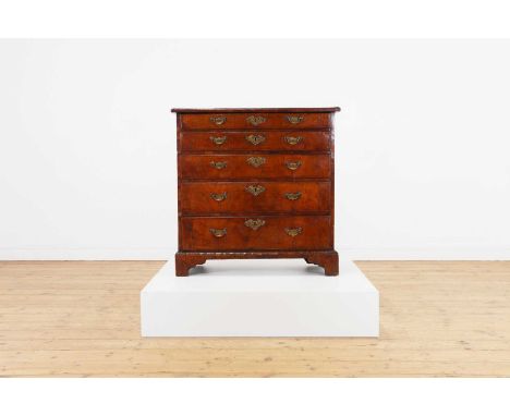 A George I walnut chest of drawers,c.1720, the rectangular top above five graduated drawers,83cm wide37cm deep83cm highProven