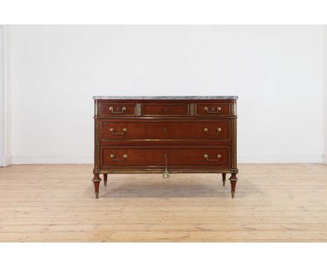 A Louis XVI mahogany and gilt-metal-mounted commode,c.1790, the grey marble top above an arrangement of five drawers, raised 