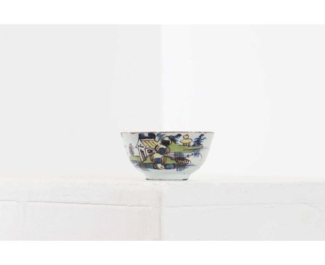 A small delft tin-glazed bowl, 18th century, of circular form, decorated with a building in a landscape,7.5cm diameter4cm hig