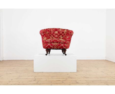 A Victorian walnut tub chair, c.1890, covered in foliate silk with a buttoned back, raised on ring-turned front supports, ter