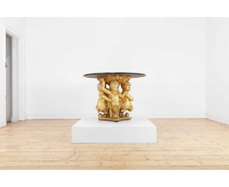 A giltwood and marble centre table,19th century and later, the circular grey marble top raised on a putti-decorated base, 99c