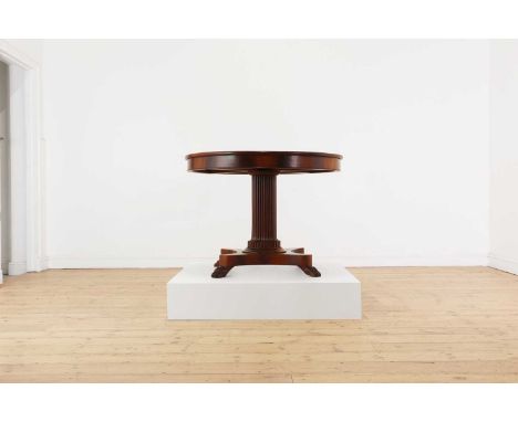 A Charles X mahogany guéridon,second quarter of the 19th century, French, the circular top above a reeded column and quadripa