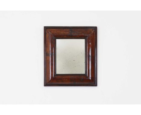A walnut cushion-framed mirror,18th century and later, the rectangular mirrored plate within a moulded frame,42cm wide5cm dee