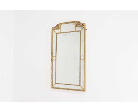 A Louis XVI-style gilt gesso and glass mirror,early 20th century, with foliate detail and sectional borders surrounding a rec