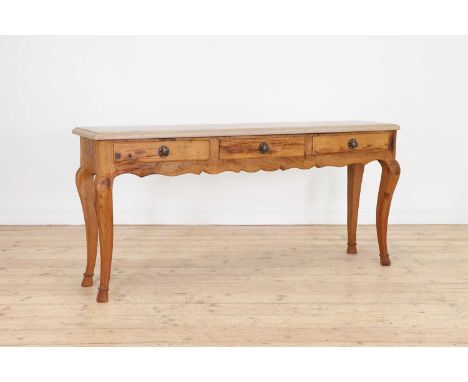 A narrow oak console table,of recent manufacture, Continental, with a pale marble top above three frieze drawers, raised on c