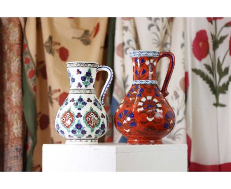 A Samson porcelain Iznik-style jug,late 19th century, the bulbous body decorated with blue and white floral sprays, to a red 