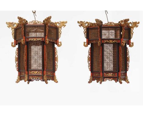 A pair of export painted lanterns,20th century, Chinese, each of hexagonal shape with dragon and pierced lattice detail, 64cm