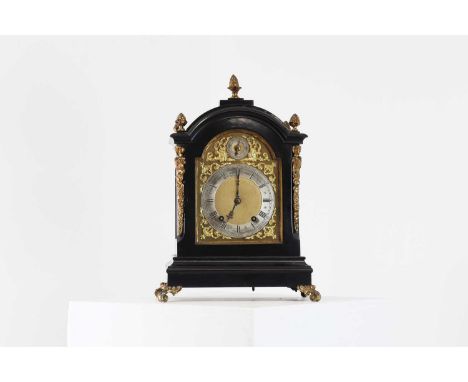 A George III-style ebonised bracket clock,c.1900, the arched brass dial with a subsidiary slow/fast dial and silvered chapter