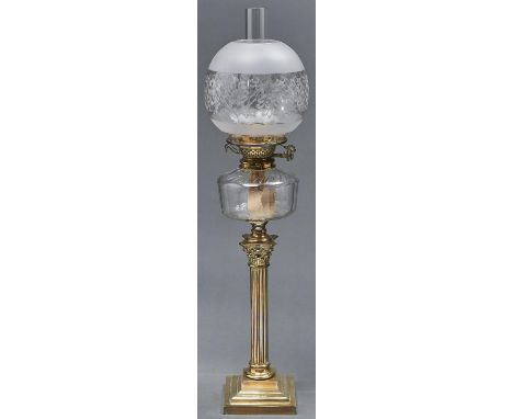 An Edwardian brass columnar oil lamp, with faceted cut glass fount and brass burner, etched glass globe, 70cm h excluding chi