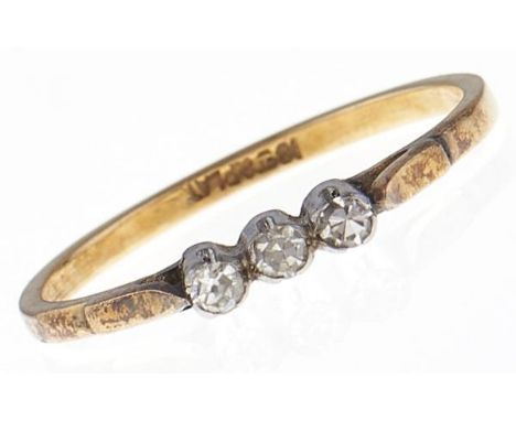 A three stone diamond ring, in gold marked 18ct &amp; PLAT, 2g, size N  Light wear