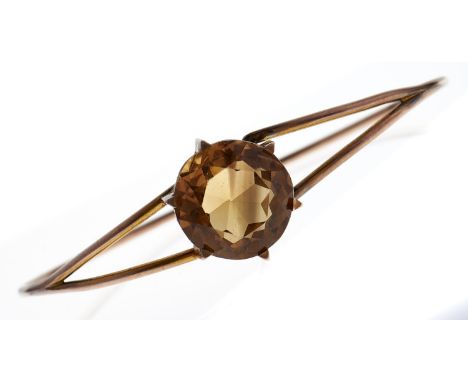 A citrine bangle, c1900, in gold wirework, 10.4g  Good condition