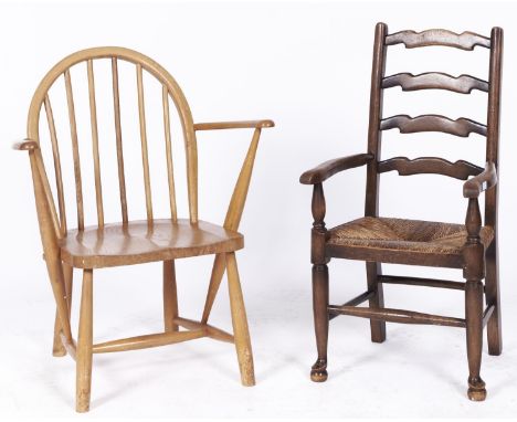 An Ercol child's armchair, with a child's rush seated ash ladder back armchair  Stains and scratches