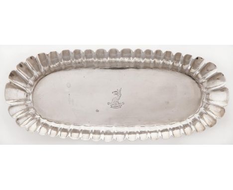 An Irish George II silver spoon tray, with fluted sides, crested, the underside engraved with contemporary initials E * S, 18