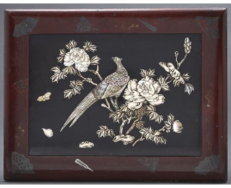 A Japanese carved bone, mother of pearl and lacquer panel of a peasant and flower, in red lacquer frame, Meiji,&nbsp; 27.5 x 