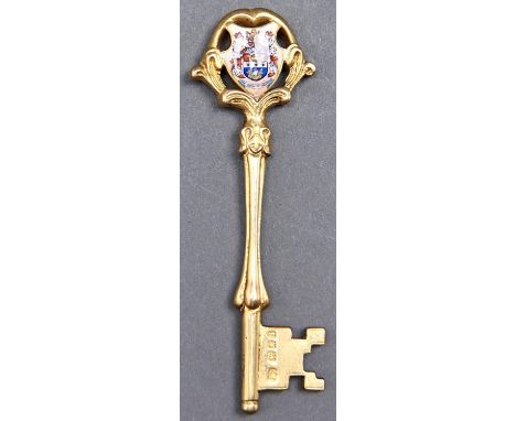 A George V silver gilt and enamel ceremonial key, engraved Blyth Fire Station Presented by Messrs T S Hedley and Sons to R Sm