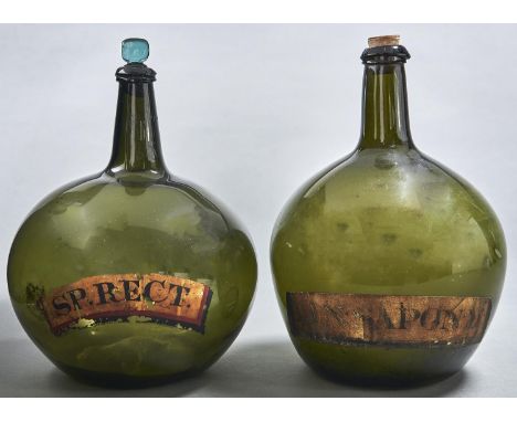 Two similar English pear shaped glass utility bottles, early 19th c, with early gilt labels LIN SAPON M or SP RECT, 28 and 30