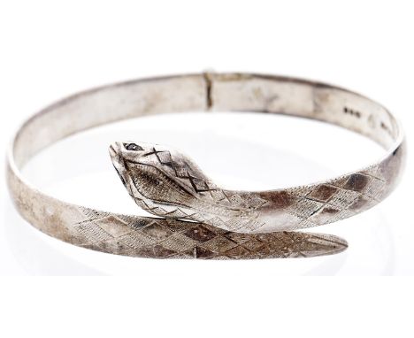 A silver snake bangle, London 1979  