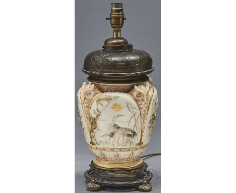 A Victorian oxidised and gilt brass mounted Royal Worcester owl lamp, moulded in relief with panels of birds and foliage, dec