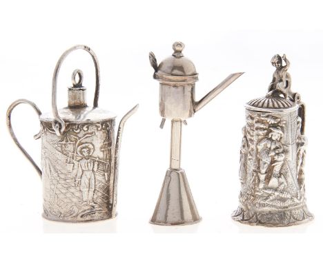 A German miniature silver watering can, with wire spout and handles, 55mm h, a German miniature cast silver model of a tankar