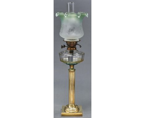 An Edwardian brass oil lamp, with faceted glass fount and brass burner, etched green shaded glass shade, 65cm h excluding chi