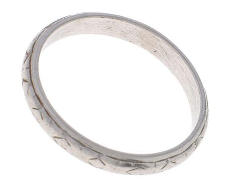 A platinum wedding ring, marked PLAT, 3.3g, size K  Wear consistent with age