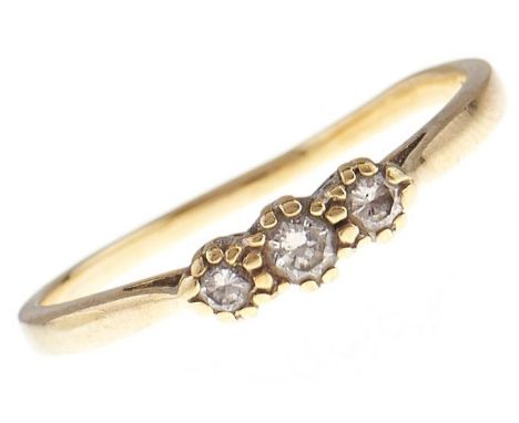 A three stone diamond ring, in 18ct gold, 2.7g, size T  Hoop worn and slightly distorted
