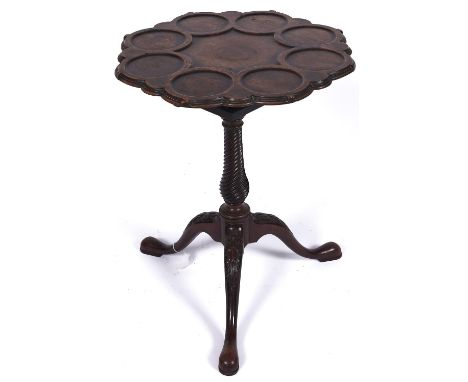 A George III mahogany supper table, c1780, the moulded top on 'birdcage' action and spirally fluted baluster pillar, the legs