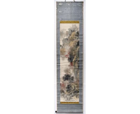 A Chinese scroll painting of a bearded figure on a mountain ledge, within extensive wooded rocky outcrop, signed in red and b