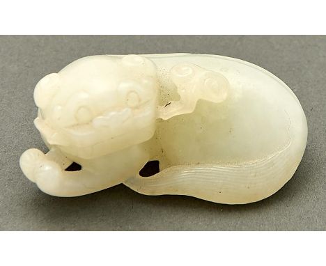 A Chinese celadon jade pebble carving of a dog and linghzi, 19th / 20th c, 50mm l  Undamaged