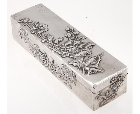 A Chinese silver repousse box, late 19th c, the lid and sides crisply decorated with flowering plants, engraved with contempo