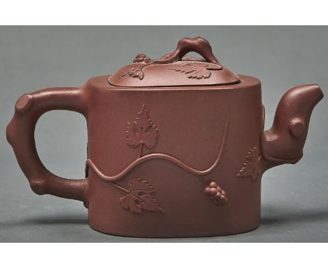 A Chinese Yixing stoneware teapot and cover, of oblong form and applied with squirrel and fruit, 10.5cm h, impressed seal  Fl