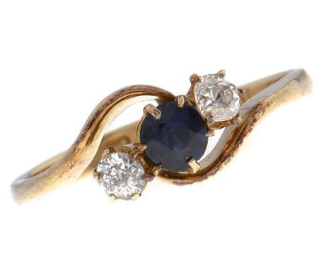 A sapphire and diamond crossover ring,&nbsp; in 18ct gold, Chester 1912, 2.5g, size L½  Good condition