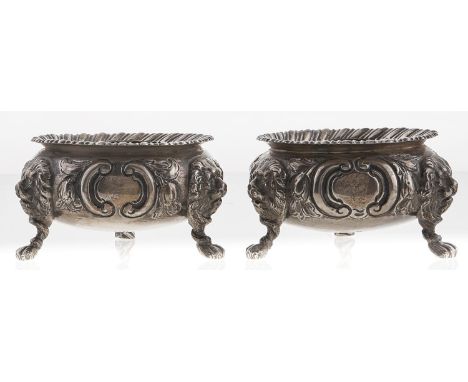 A pair of Victorian silver salt cellars, chased with flowers, on three lion mask and paw feet, 80mm diam, London 1859, 8ozs 9