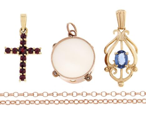 A gold and mother of pearl tambourine charm, early 20th c, 14mm, marked 9c, a garnet set gold cross, a sapphire set gold pend