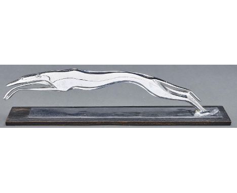 A Hagenauer&nbsp; chromium plated brass sculpture of a leaping greyhound,&nbsp; 1930s&nbsp;on stained wood plinth, 51cm l, st