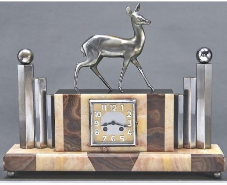 A French Art Deco noir belge, spelter and chromium plated brass mantle clock, c1930, the rectangular case set with a deer fla