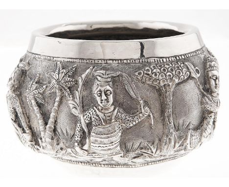 A Burmese silver repousse bowl, c1900, with high relief jataka figures and jungle, 60mm h, maker's mark a peacock, 3ozs  Good