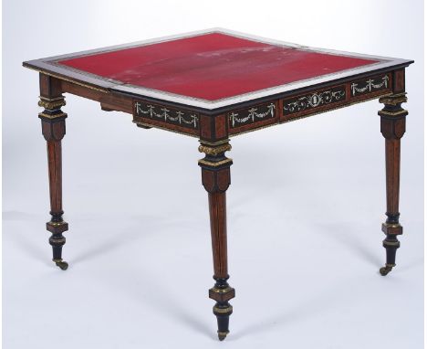 A French gilt brass mounted, ivory inlaid and penwork decorated amboyna and ebony card table, c1870, the quarter veneered top