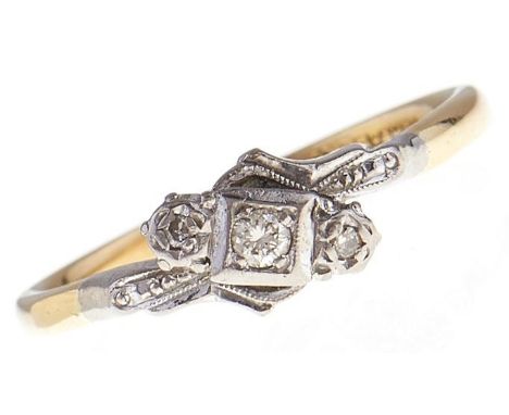 A three stone diamond ring, in gold marked 18ct &amp; PLAT, 3.1g, size R  Good condition