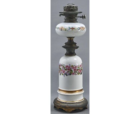 A French brass mounted porcelain oil lamp, late 19th c,&nbsp;the domed base painted with wild roses, the white glass fount en