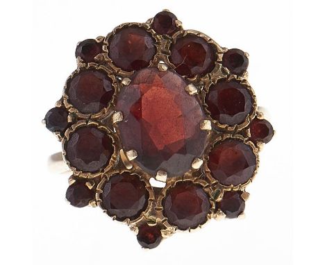 A garnet cluster ring, in 9ct gold, 4.8g, size L  Hoop slightly bent