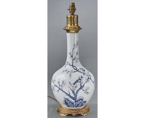 A giltmetal mounted Chinese style blue and white bottle vase table lamp, 20th c, 51cm h excluding fitment  Good condition