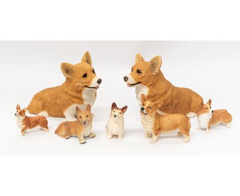 A collection of Sandicast corgi dogs, including two large approx 34cm long, three smaller; and two ceramic corgis (7)